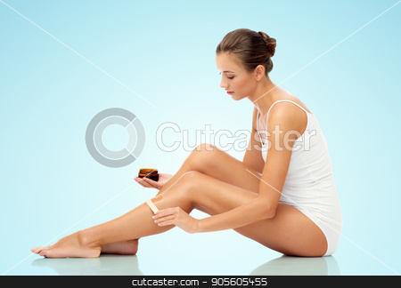 To use this stock image in your creative project, please select the size you need over to the right and click the "Add to Cart" button.
Your downloaded image will come with the Cutcaster watermark removed so don’t worry about the watermark you see on this page. beautiful woman applying depilatory wax to her leg stock photo, beauty, hair removal and people concept - beautiful woman with applicator applying depilatory wax to her leg over blue background by Syda Productions