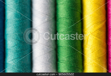 To use this stock image in your creative project, please select the size you need over to the right and click the "Add to Cart" button.
Your downloaded image will come with the Cutcaster watermark removed so don’t worry about the watermark you see on this page. row of colorful thread spools on table stock photo, needlework, craft, sewing and tailoring concept - row of colorful thread spools on table by Syda Productions