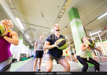 To use this stock image in your creative project, please select the size you need over to the right and click the "Add to Cart" button.
Your downloaded image will come with the Cutcaster watermark removed so don’t worry about the watermark you see on this page. group of people with medicine ball training in gym stock photo, fitness, sport and exercising concept - group of people with medicine balls training in gym and coach writing to clipboard by Syda Productions