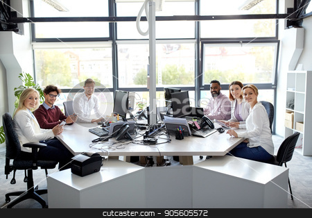To use this stock image in your creative project, please select the size you need over to the right and click the "Add to Cart" button.
Your downloaded image will come with the Cutcaster watermark removed so don’t worry about the watermark you see on this page. business team with computers working at office stock photo, corporate, technology and people concept - business team with smartphones and computers working at office by Syda Productions