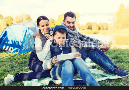To use this stock image in your creative project, please select the size you need over to the right and click the "Add to Cart" button.
Your downloaded image will come with the Cutcaster watermark removed so don’t worry about the watermark you see on this page. happy family with tablet pc and tent at camp site stock photo, camping, tourism, hike, technology and people concept - happy family with tablet pc computer and tent at camp site by Syda Productions