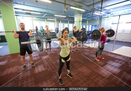 To use this stock image in your creative project, please select the size you need over to the right and click the "Add to Cart" button.
Your downloaded image will come with the Cutcaster watermark removed so don’t worry about the watermark you see on this page. group of people training with barbells in gym stock photo, fitness, sport, training, exercising and lifestyle concept - group of people with barbells doing standing shoulder press in gym by Syda Productions