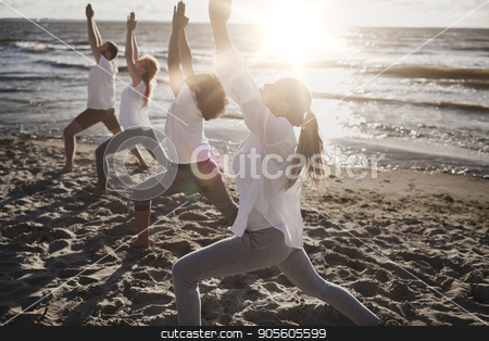 To use this stock image in your creative project, please select the size you need over to the right and click the "Add to Cart" button.
Your downloaded image will come with the Cutcaster watermark removed so don’t worry about the watermark you see on this page. group of people making yoga exercises on beach stock photo, fitness, sport, yoga and healthy lifestyle concept - group of people making high lunge or crescent pose on beach by Syda Productions