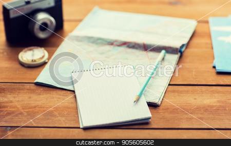 To use this stock image in your creative project, please select the size you need over to the right and click the "Add to Cart" button.
Your downloaded image will come with the Cutcaster watermark removed so don’t worry about the watermark you see on this page. close up of notepad with map and travel tickets stock photo, vacation, tourism, travel and objects concept - close up of blank notepad with map and airplane tickets by Syda Productions