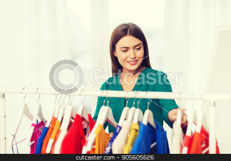 To use this stock image in your creative project, please select the size you need over to the right and click the "Add to Cart" button.
Your downloaded image will come with the Cutcaster watermark removed so don’t worry about the watermark you see on this page. happy woman choosing clothes at home wardrobe stock photo, clothing, fashion, style and people concept - happy woman choosing clothes at home wardrobe by Syda Productions