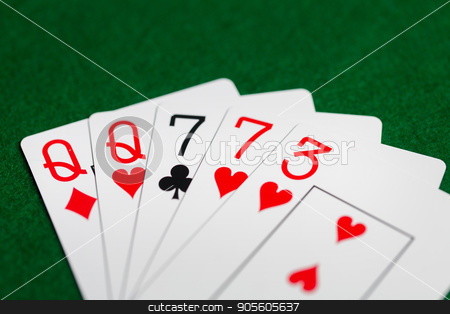 To use this stock image in your creative project, please select the size you need over to the right and click the "Add to Cart" button.
Your downloaded image will come with the Cutcaster watermark removed so don’t worry about the watermark you see on this page. poker hand of playing cards on green casino cloth stock photo, casino, gambling, games of chance, hazard and entertainment concept - poker hand of playing cards on green cloth by Syda Productions