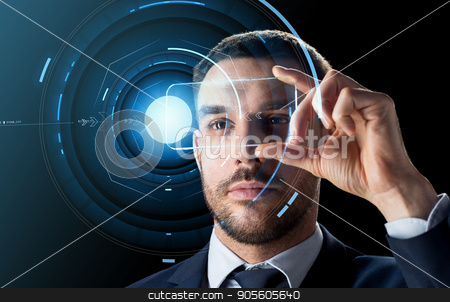 To use this stock image in your creative project, please select the size you need over to the right and click the "Add to Cart" button.
Your downloaded image will come with the Cutcaster watermark removed so don’t worry about the watermark you see on this page. businessman with transparent smartphone stock photo, business, augmented reality and future technology concept - businessman in suit working with transparent smartphone and hologram over black background by Syda Productions