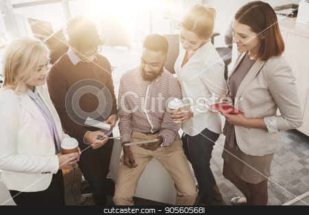To use this stock image in your creative project, please select the size you need over to the right and click the "Add to Cart" button.
Your downloaded image will come with the Cutcaster watermark removed so don’t worry about the watermark you see on this page. business team with tablet pc and coffee at office stock photo, business, technology, break and people concept - happy creative team with tablet pc computer drinking coffee and talking at office by Syda Productions