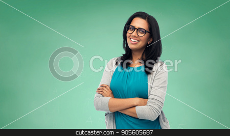 To use this stock image in your creative project, please select the size you need over to the right and click the "Add to Cart" button.
Your downloaded image will come with the Cutcaster watermark removed so don’t worry about the watermark you see on this page. happy smiling young indian woman in glasses stock photo, education, school and people concept - happy smiling young indian student woman or teacher in glasses over green chalkboard background by Syda Productions