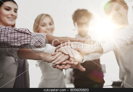 To use this stock image in your creative project, please select the size you need over to the right and click the "Add to Cart" button.
Your downloaded image will come with the Cutcaster watermark removed so don’t worry about the watermark you see on this page. happy business team with hands on top at office stock photo, business, startup, gesture, people and teamwork concept - happy creative team with hands on top of each other at office by Syda Productions