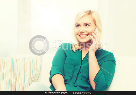 To use this stock image in your creative project, please select the size you need over to the right and click the "Add to Cart" button.
Your downloaded image will come with the Cutcaster watermark removed so don’t worry about the watermark you see on this page. happy young woman calling on smartphone at home stock photo, people, technology, communication and leisure concept - happy young woman calling on smartphone at home by Syda Productions