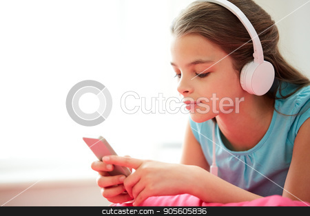 To use this stock image in your creative project, please select the size you need over to the right and click the "Add to Cart" button.
Your downloaded image will come with the Cutcaster watermark removed so don’t worry about the watermark you see on this page. close up of girl with smartphone and headphones stock photo, children, technology and people concept - close up of happy girl with smartphone and headphones listening to music at home by Syda Productions