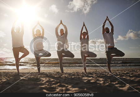 To use this stock image in your creative project, please select the size you need over to the right and click the "Add to Cart" button.
Your downloaded image will come with the Cutcaster watermark removed so don’t worry about the watermark you see on this page. group of people making yoga in tree pose on beach stock photo, yoga, fitness, sport and healthy lifestyle concept - group of people in tree pose on beach by Syda Productions