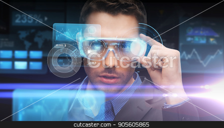 To use this stock image in your creative project, please select the size you need over to the right and click the "Add to Cart" button.
Your downloaded image will come with the Cutcaster watermark removed so don’t worry about the watermark you see on this page. businessman in virtual reality or 3d glasses stock photo, augmented reality, technology, business and people concept -businessman in virtual glasses looking at screen projections over dark background by Syda Productions