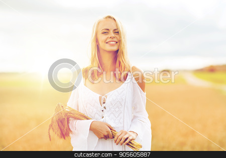 To use this stock image in your creative project, please select the size you need over to the right and click the "Add to Cart" button.
Your downloaded image will come with the Cutcaster watermark removed so don’t worry about the watermark you see on this page. happy young woman with spikelets on cereal field stock photo, country, nature, summer holidays, vacation and people concept - smiling young woman in white dress with spikelets walking along on cereal field by Syda Productions