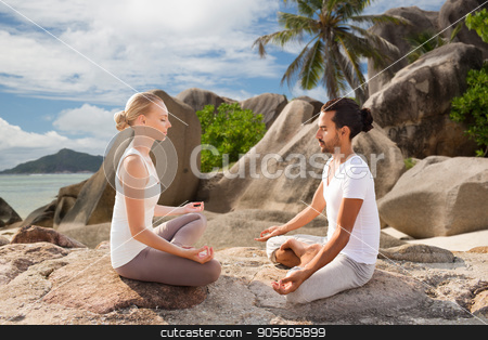 To use this stock image in your creative project, please select the size you need over to the right and click the "Add to Cart" button.
Your downloaded image will come with the Cutcaster watermark removed so don’t worry about the watermark you see on this page. happy couple doing yoga and meditating outdoors stock photo, fitness, sport, meditation and people concept - happy couple doing yoga and meditating outdoors over tropical natural background by Syda Productions