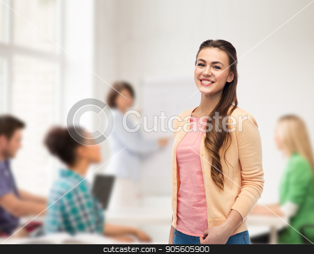 To use this stock image in your creative project, please select the size you need over to the right and click the "Add to Cart" button.
Your downloaded image will come with the Cutcaster watermark removed so don’t worry about the watermark you see on this page. happy smiling young woman in cardigan stock photo, education, high school and people concept - happy smiling young student woman over classroom background by Syda Productions