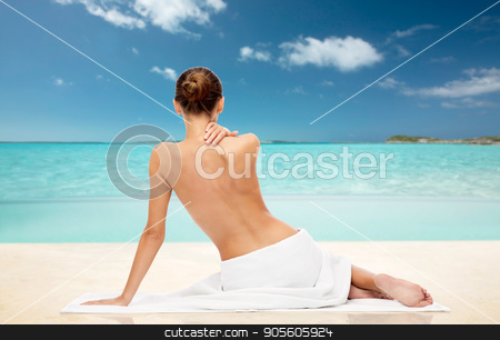 To use this stock image in your creative project, please select the size you need over to the right and click the "Add to Cart" button.
Your downloaded image will come with the Cutcaster watermark removed so don’t worry about the watermark you see on this page. beautiful woman in towel with bare top on beach stock photo, beauty, people and bodycare concept - beautiful young woman in white towel with bare top over exotic tropical beach background by Syda Productions