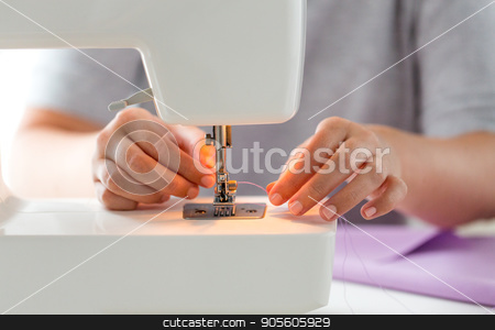 To use this stock image in your creative project, please select the size you need over to the right and click the "Add to Cart" button.
Your downloaded image will come with the Cutcaster watermark removed so don’t worry about the watermark you see on this page. tailor woman threading needle of sewing machine stock photo, people, needlework and tailoring concept - tailor woman threading needle of sewing machine at studio by Syda Productions