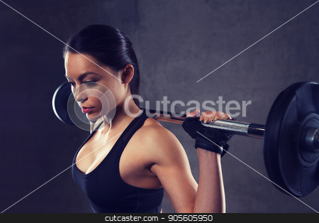 To use this stock image in your creative project, please select the size you need over to the right and click the "Add to Cart" button.
Your downloaded image will come with the Cutcaster watermark removed so don’t worry about the watermark you see on this page. young woman flexing muscles with barbell in gym stock photo, sport, fitness, bodybuilding, weightlifting and people concept - young woman with barbell flexing muscles in gym by Syda Productions