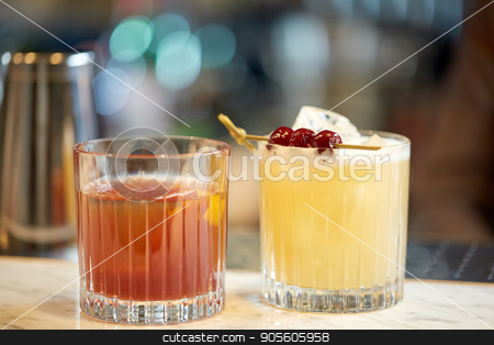 To use this stock image in your creative project, please select the size you need over to the right and click the "Add to Cart" button.
Your downloaded image will come with the Cutcaster watermark removed so don’t worry about the watermark you see on this page. glasses of cocktails at bar stock photo, alcohol drinks and luxury concept - glasses of cocktails at bar by Syda Productions