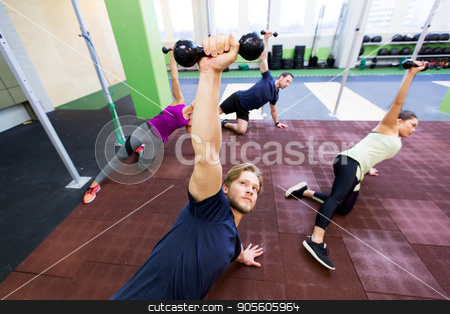 To use this stock image in your creative project, please select the size you need over to the right and click the "Add to Cart" button.
Your downloaded image will come with the Cutcaster watermark removed so don’t worry about the watermark you see on this page. group of people working out with dumbbells stock photo, fitness, sport and training concept - group of people working out with dumbbells in gym by Syda Productions