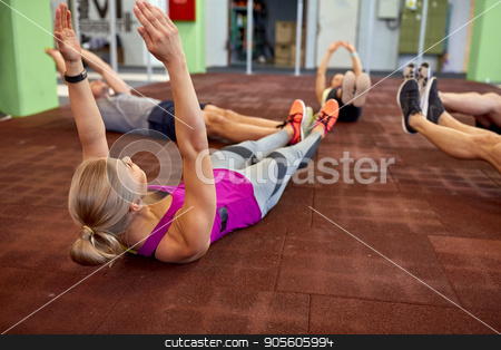 To use this stock image in your creative project, please select the size you need over to the right and click the "Add to Cart" button.
Your downloaded image will come with the Cutcaster watermark removed so don’t worry about the watermark you see on this page. group of people exercising in gym stock photo, fitness, sport, training and lifestyle concept - group of people exercising in gym by Syda Productions