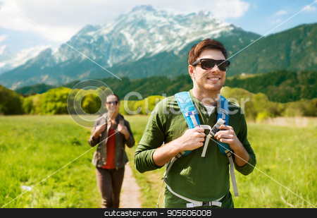 To use this stock image in your creative project, please select the size you need over to the right and click the "Add to Cart" button.
Your downloaded image will come with the Cutcaster watermark removed so don’t worry about the watermark you see on this page. happy couple with backpacks hiking outdoors stock photo, travel, tourism and people concept - happy couple with backpacks walking along country road over mountains background by Syda Productions