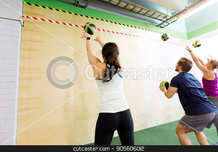 To use this stock image in your creative project, please select the size you need over to the right and click the "Add to Cart" button.
Your downloaded image will come with the Cutcaster watermark removed so don’t worry about the watermark you see on this page. group of people with medicine ball training in gym stock photo, fitness, sport and exercising concept - group of people with medicine balls training in gym by Syda Productions