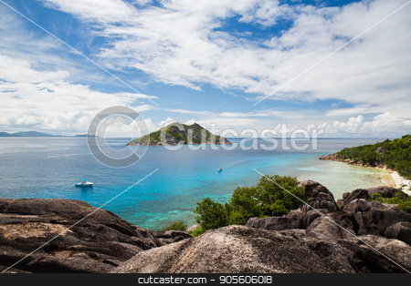 To use this stock image in your creative project, please select the size you need over to the right and click the "Add to Cart" button.
Your downloaded image will come with the Cutcaster watermark removed so don’t worry about the watermark you see on this page. island and boats in indian ocean on seychelles stock photo, travel, landscape and nature concept - island and boats in indian ocean on seychelles by Syda Productions