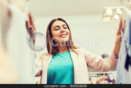 To use this stock image in your creative project, please select the size you need over to the right and click the "Add to Cart" button.
Your downloaded image will come with the Cutcaster watermark removed so don’t worry about the watermark you see on this page. happy young woman choosing clothes in mall stock photo, sale, shopping, fashion, style and people concept - happy young woman choosing clothes in mall or clothing store by Syda Productions