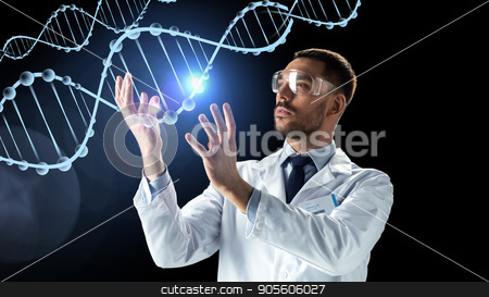 To use this stock image in your creative project, please select the size you need over to the right and click the "Add to Cart" button.
Your downloaded image will come with the Cutcaster watermark removed so don’t worry about the watermark you see on this page. scientist in lab coat and safety glasses with dna stock photo, science, genetics and people concept - male doctor or scientist in white coat and safety glasses with dna molecule projection over black background by Syda Productions