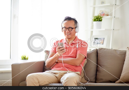 To use this stock image in your creative project, please select the size you need over to the right and click the "Add to Cart" button.
Your downloaded image will come with the Cutcaster watermark removed so don’t worry about the watermark you see on this page. man with smartphone and headphones at home stock photo, technology, people and lifestyle concept - happy man with smartphone and headphones listening to music at home by Syda Productions