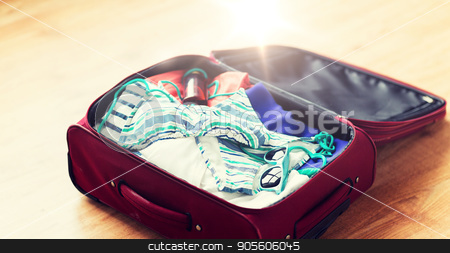 To use this stock image in your creative project, please select the size you need over to the right and click the "Add to Cart" button.
Your downloaded image will come with the Cutcaster watermark removed so don’t worry about the watermark you see on this page. close up of travel bag with beach clothes stock photo, summer vacation, travel, tourism and objects concept - close up of travel bag with beach clothes, sunglasses and sunscreen by Syda Productions