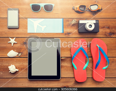 To use this stock image in your creative project, please select the size you need over to the right and click the "Add to Cart" button.
Your downloaded image will come with the Cutcaster watermark removed so don’t worry about the watermark you see on this page. close up of tablet pc and travel stuff stock photo, vacation, travel, tourism, technology and objects concept - close up of tablet pc computer and travel stuff by Syda Productions