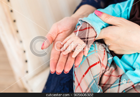 To use this stock image in your creative project, please select the size you need over to the right and click the "Add to Cart" button.
Your downloaded image will come with the Cutcaster watermark removed so don’t worry about the watermark you see on this page. Concept of love and family. hands of mother and baby closeup stock photo, Concept of love and family. hands of mother and baby closeup by Satura86