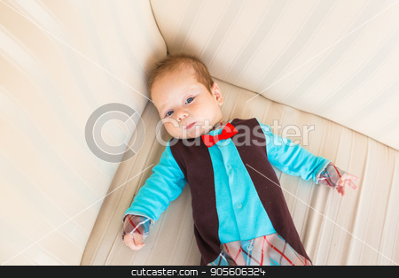 To use this stock image in your creative project, please select the size you need over to the right and click the "Add to Cart" button.
Your downloaded image will come with the Cutcaster watermark removed so don’t worry about the watermark you see on this page. bright portrait of adorable baby stock photo, bright portrait of adorable baby boy indoors by Satura86