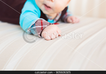 To use this stock image in your creative project, please select the size you need over to the right and click the "Add to Cart" button.
Your downloaded image will come with the Cutcaster watermark removed so don’t worry about the watermark you see on this page. Close-up of hand adorable newborn baby at home stock photo, The hand adorable newborn baby at home by Satura86
