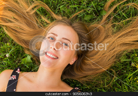 To use this stock image in your creative project, please select the size you need over to the right and click the "Add to Cart" button.
Your downloaded image will come with the Cutcaster watermark removed so don’t worry about the watermark you see on this page. Portrait of a young woman lying on the grass stock photo, Portrait of a young woman lying on the grass by Satura86