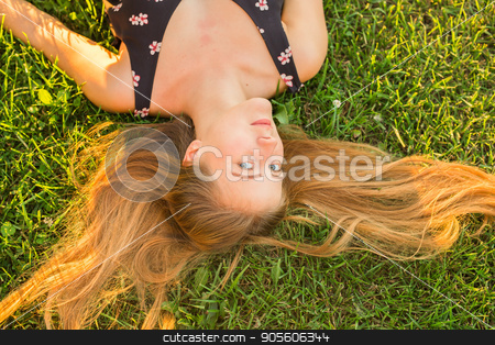To use this stock image in your creative project, please select the size you need over to the right and click the "Add to Cart" button.
Your downloaded image will come with the Cutcaster watermark removed so don’t worry about the watermark you see on this page. Beautiful Young Woman lying in Meadow. Enjoy Nature stock photo, Beautiful Young Woman lying in Meadow. Enjoy Nature by Satura86