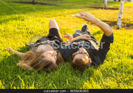 To use this stock image in your creative project, please select the size you need over to the right and click the "Add to Cart" button.
Your downloaded image will come with the Cutcaster watermark removed so don’t worry about the watermark you see on this page. Spring outdoor portrait of young happy couple lying on the grass stock photo, Spring outdoor portrait of young happy couple by Satura86