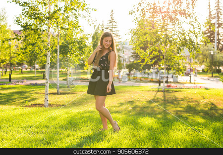To use this stock image in your creative project, please select the size you need over to the right and click the "Add to Cart" button.
Your downloaded image will come with the Cutcaster watermark removed so don’t worry about the watermark you see on this page. Attractive young woman enjoying her time outside in park with sunset in background stock photo, Attractive young woman enjoying her time outside in park with sunset in background by Satura86