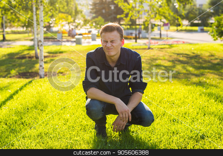 To use this stock image in your creative project, please select the size you need over to the right and click the "Add to Cart" button.
Your downloaded image will come with the Cutcaster watermark removed so don’t worry about the watermark you see on this page. Young funny guy in the park stock photo, Young man in the park listen to the music by Satura86