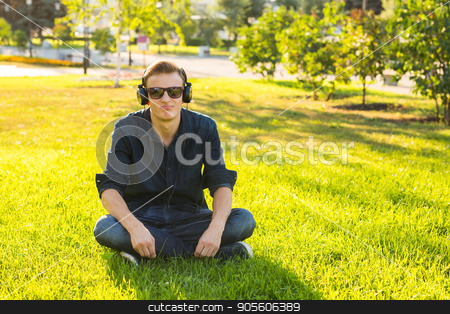 To use this stock image in your creative project, please select the size you need over to the right and click the "Add to Cart" button.
Your downloaded image will come with the Cutcaster watermark removed so don’t worry about the watermark you see on this page. Young man in the park listen to the music stock photo, Young man in the park listen to the music by Satura86