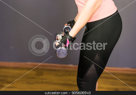 To use this stock image in your creative project, please select the size you need over to the right and click the "Add to Cart" button.
Your downloaded image will come with the Cutcaster watermark removed so don’t worry about the watermark you see on this page. Closeup on fitness woman workout with dumbbell stock photo, Closeup on fitness woman workout with dumbbell by Satura86