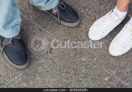 To use this stock image in your creative project, please select the size you need over to the right and click the "Add to Cart" button.
Your downloaded image will come with the Cutcaster watermark removed so don’t worry about the watermark you see on this page. Close-up of male and female legs in fashion shoes top view stock photo, Close-up of male and female legs in fashion shoes top view by Satura86