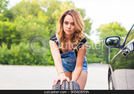 To use this stock image in your creative project, please select the size you need over to the right and click the "Add to Cart" button.
Your downloaded image will come with the Cutcaster watermark removed so don’t worry about the watermark you see on this page. Sexy woman changing wheel on a roadside stock photo, Sexy woman changing wheel on a roadside by Satura86