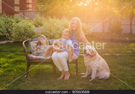 To use this stock image in your creative project, please select the size you need over to the right and click the "Add to Cart" button.
Your downloaded image will come with the Cutcaster watermark removed so don’t worry about the watermark you see on this page. Mother and her daughter and son in the garden with a golden retriever dog stock photo, Mother and her daughter and son in the garden with a golden retriever dog by Satura86