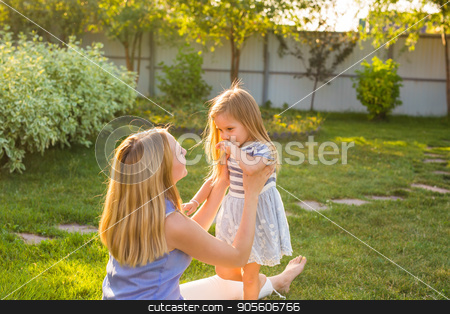 To use this stock image in your creative project, please select the size you need over to the right and click the "Add to Cart" button.
Your downloaded image will come with the Cutcaster watermark removed so don’t worry about the watermark you see on this page. happy family mother and daughter hugging in summer on the nature stock photo, happy family mother and daughter hugging in summer on the nature by Satura86