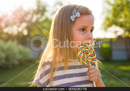 To use this stock image in your creative project, please select the size you need over to the right and click the "Add to Cart" button.
Your downloaded image will come with the Cutcaster watermark removed so don’t worry about the watermark you see on this page. cute cauasian baby girl and big lollipop stock photo, cute cauasian baby girl and big lollipop by Satura86